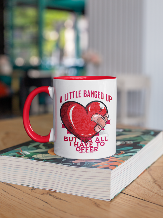 A Little Bit Banged Up - Mug - The Serpent and The Wings of Night - Carissa Broadbent - Officially Licenced - Crowns of Nyzaxia - Merchandise